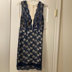 Navy lace dress with cream underlay.
